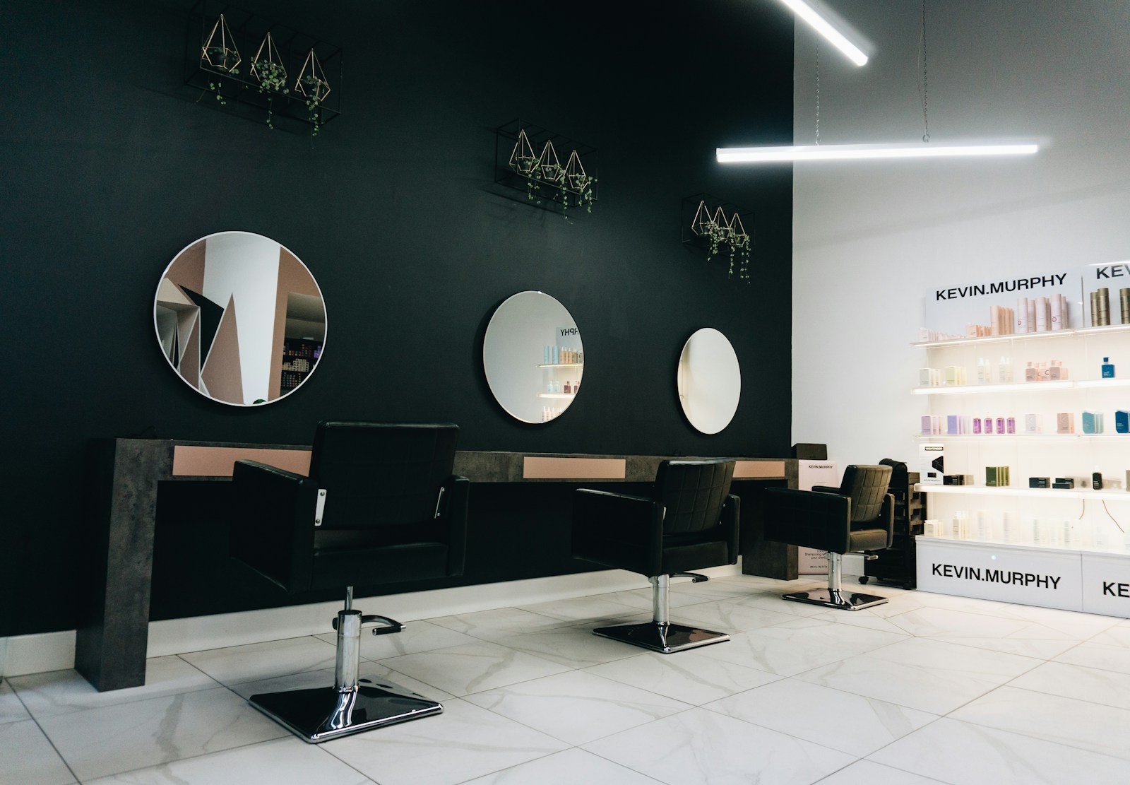 Contemporary salon interior with styling chairs and mirrors